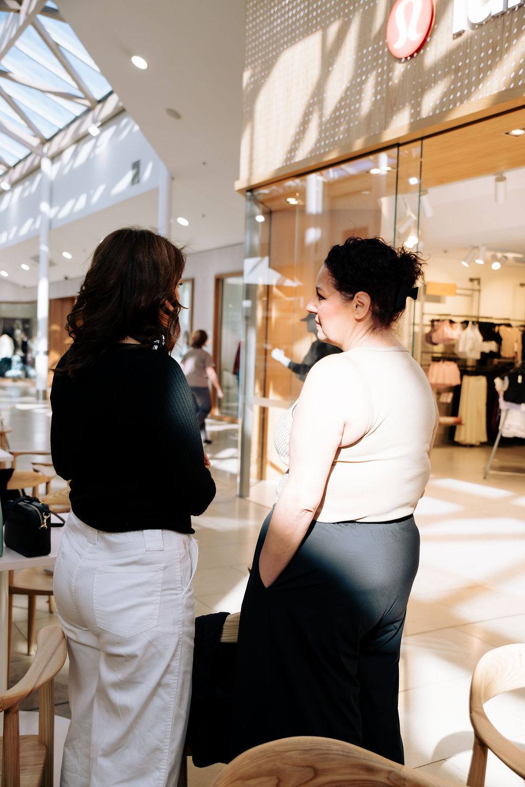 Two women deep in conversation at a Business Mums Hub event in Adelaide